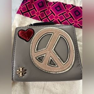 Tory Burch mini wallet with whimsical embroidered patches in French Grey